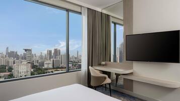 Deluxe Suite, 1 Queen Bed | In-room safe, desk, laptop workspace, blackout drapes