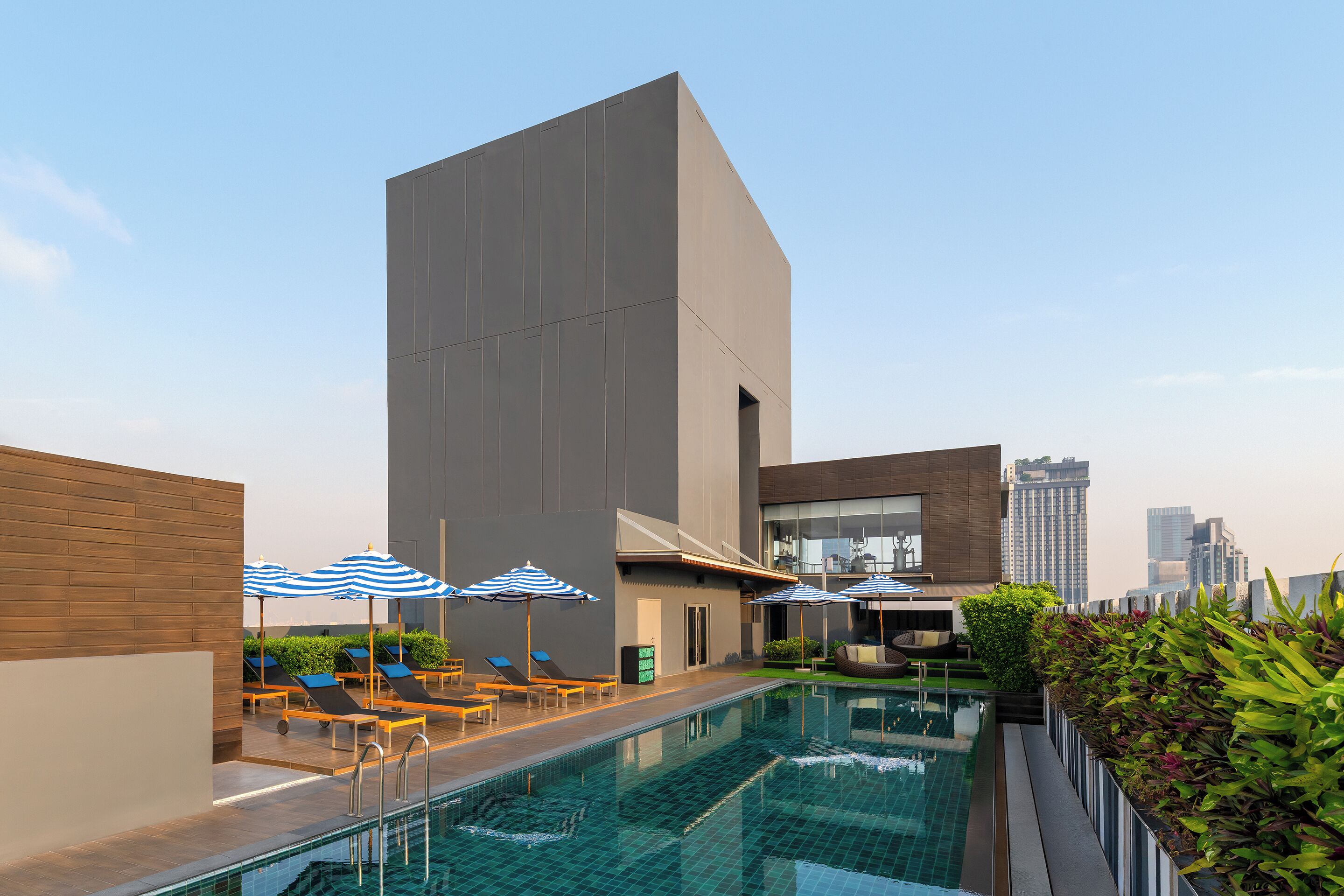 Outdoor pool, open 7:00 AM to 10:00 PM, pool umbrellas, sun loungers