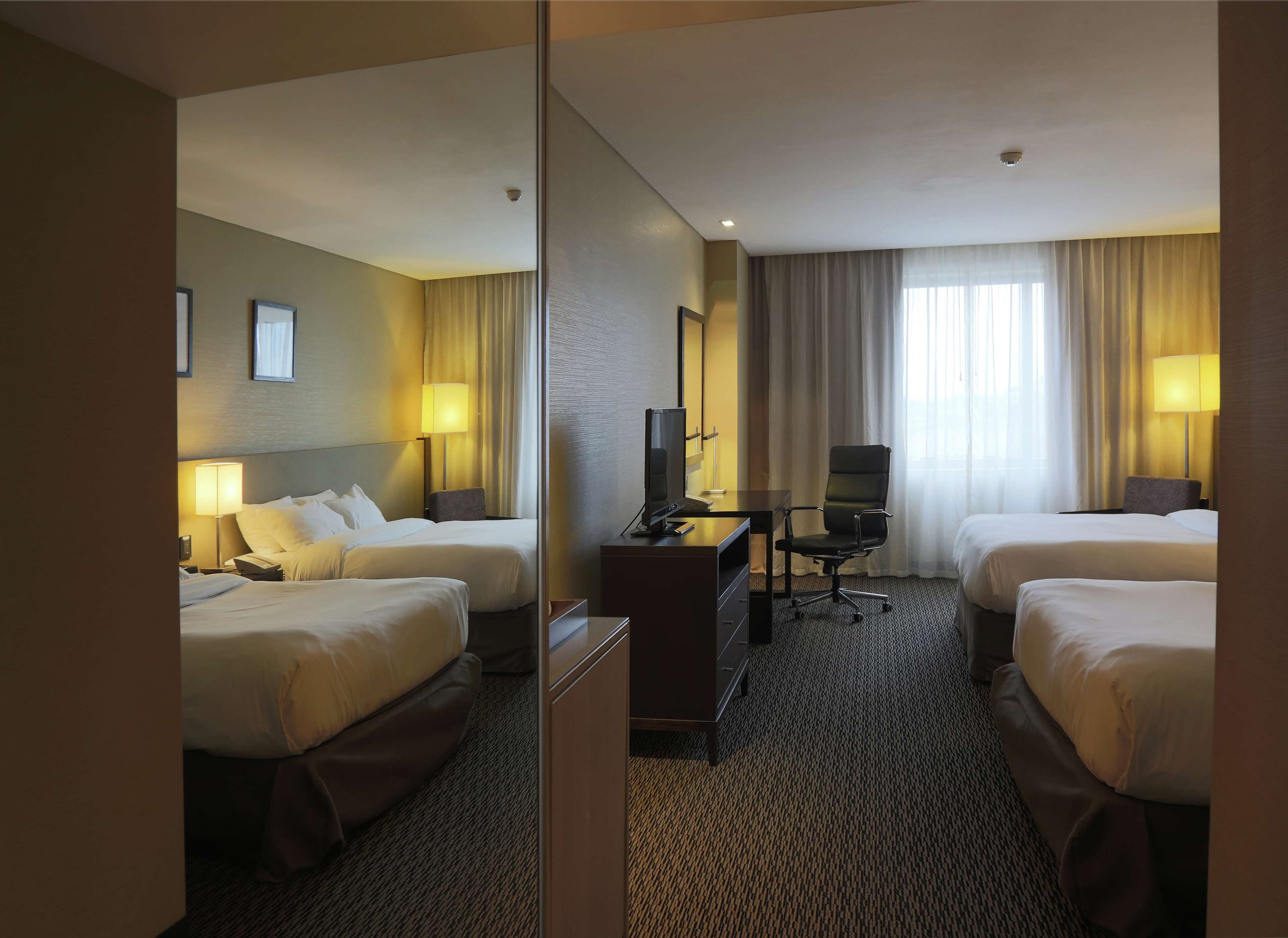 room, 2 double beds | in-room safe, desk, soundproofing, free cots/infant beds