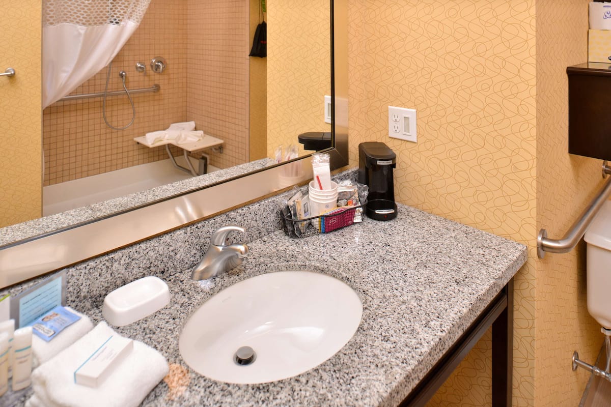 1 king, hearing, mobile accessible with roll-in shower | bathroom | free toiletries, hair dryer, towels