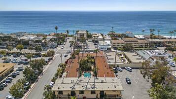 Situated in a coastal urban area, this building offers parking and ocean views.