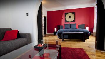 Deluxe Suite, Terrace | Living room | 92-cm flat-screen TV with cable channels, TV
