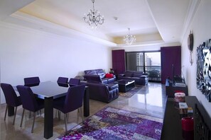 Standard Apartment, 1 Bedroom, City View | Living room | 55-inch flat-screen TV with satellite channels, TV, fireplace