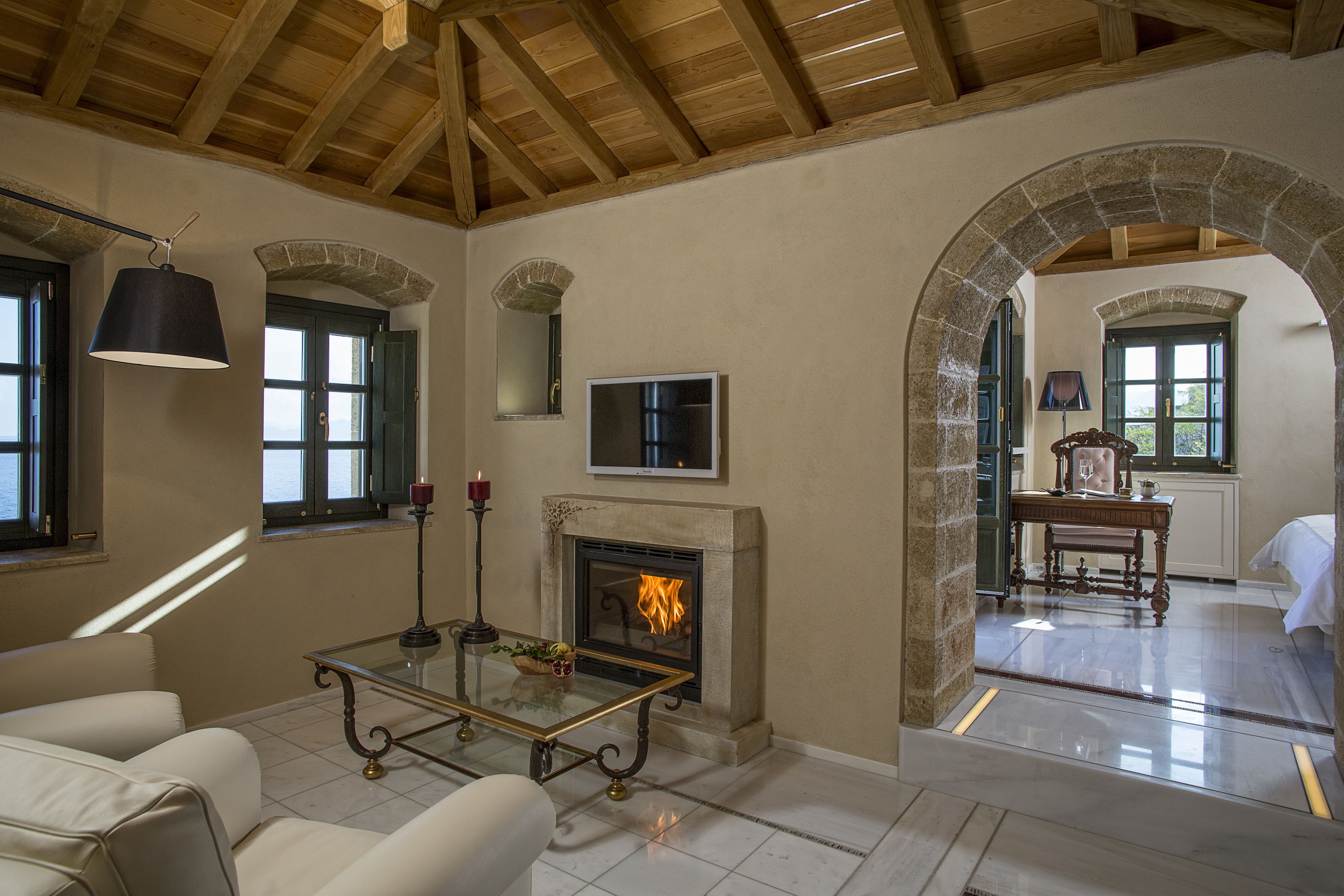 deluxe suite, balcony, sea view | living area | flat-screen tv, fireplace