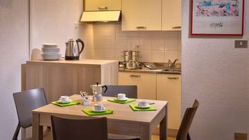 Superior Apartment, Kitchen | Private kitchenette | Fridge, stovetop, coffee/tea maker, electric kettle