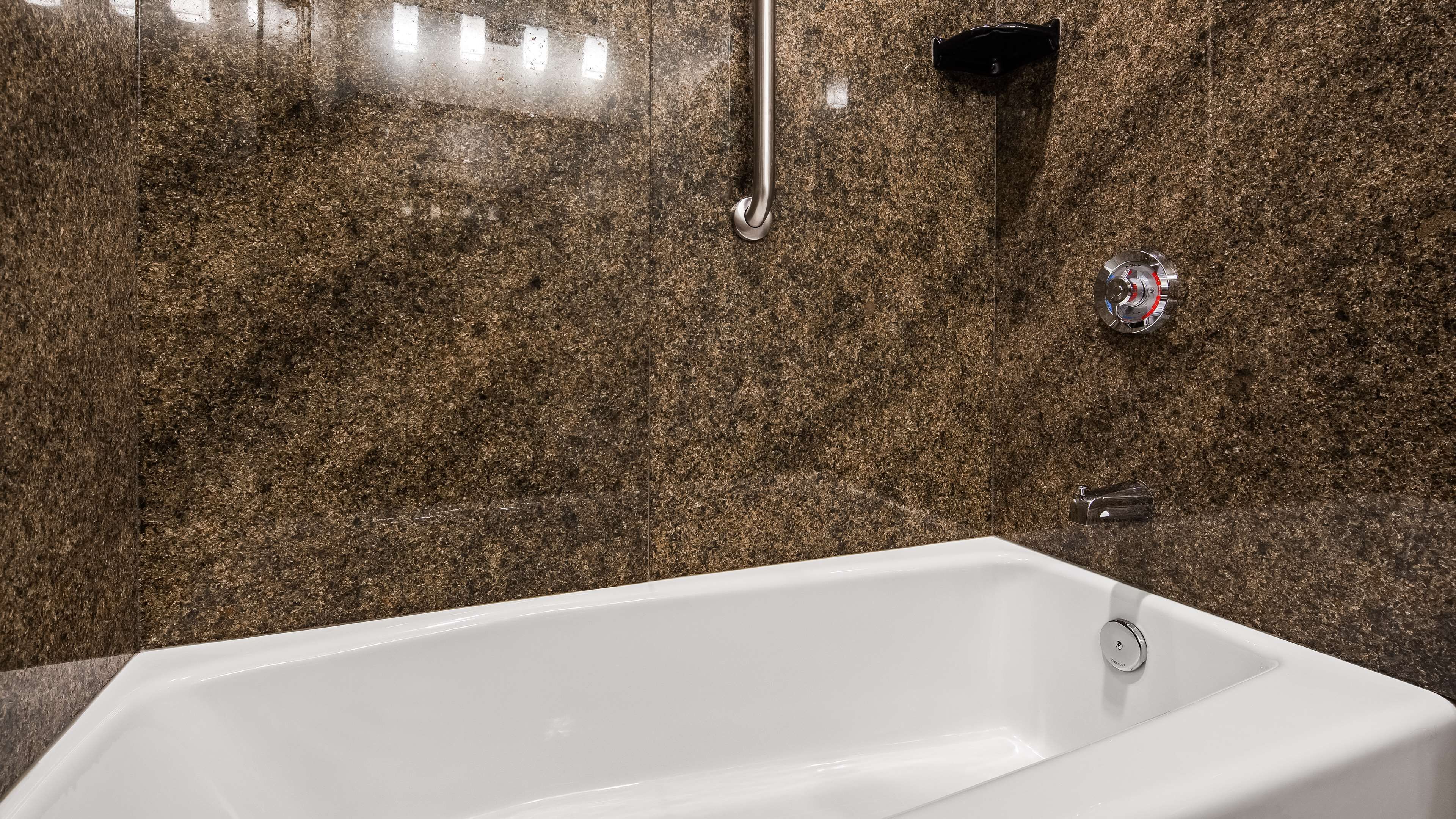 suite, 1 king bed, non smoking, refrigerator & microwave (with single sofabed) | bathroom | combined shower/bathtub, free toiletries, hair dryer, towels