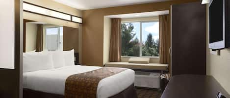 Desk, laptop workspace, blackout drapes, iron/ironing board