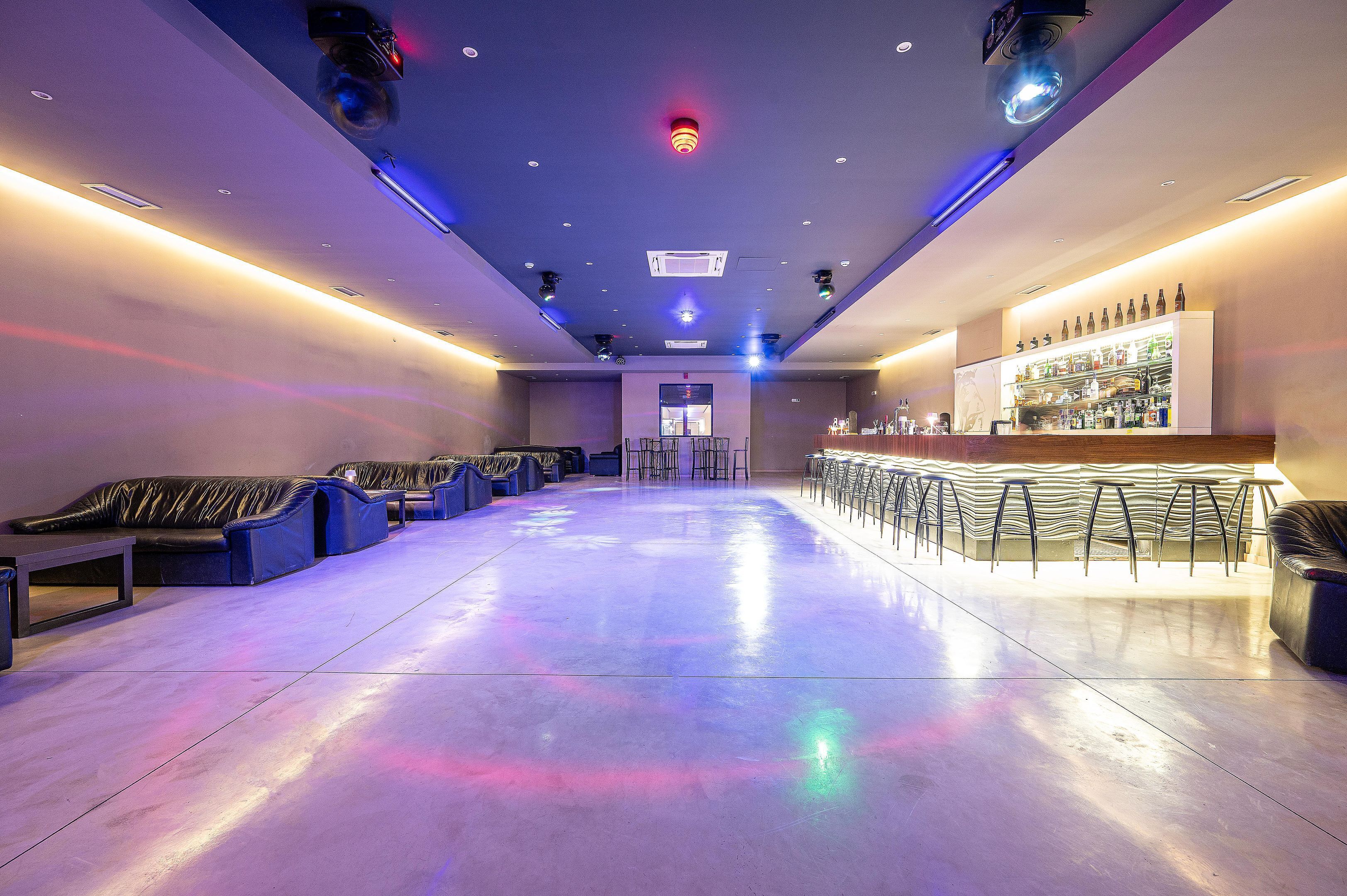 A bar area with seating and a counter.