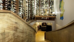 A spiral staircase with wooden steps leading to a wine cellar. - Alentejo Marmoris Hotel & Spa, (Vila Vicosa)