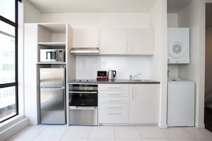 Apartment, 1 Bedroom | Private kitchen | Fridge, microwave, stovetop, dishwasher