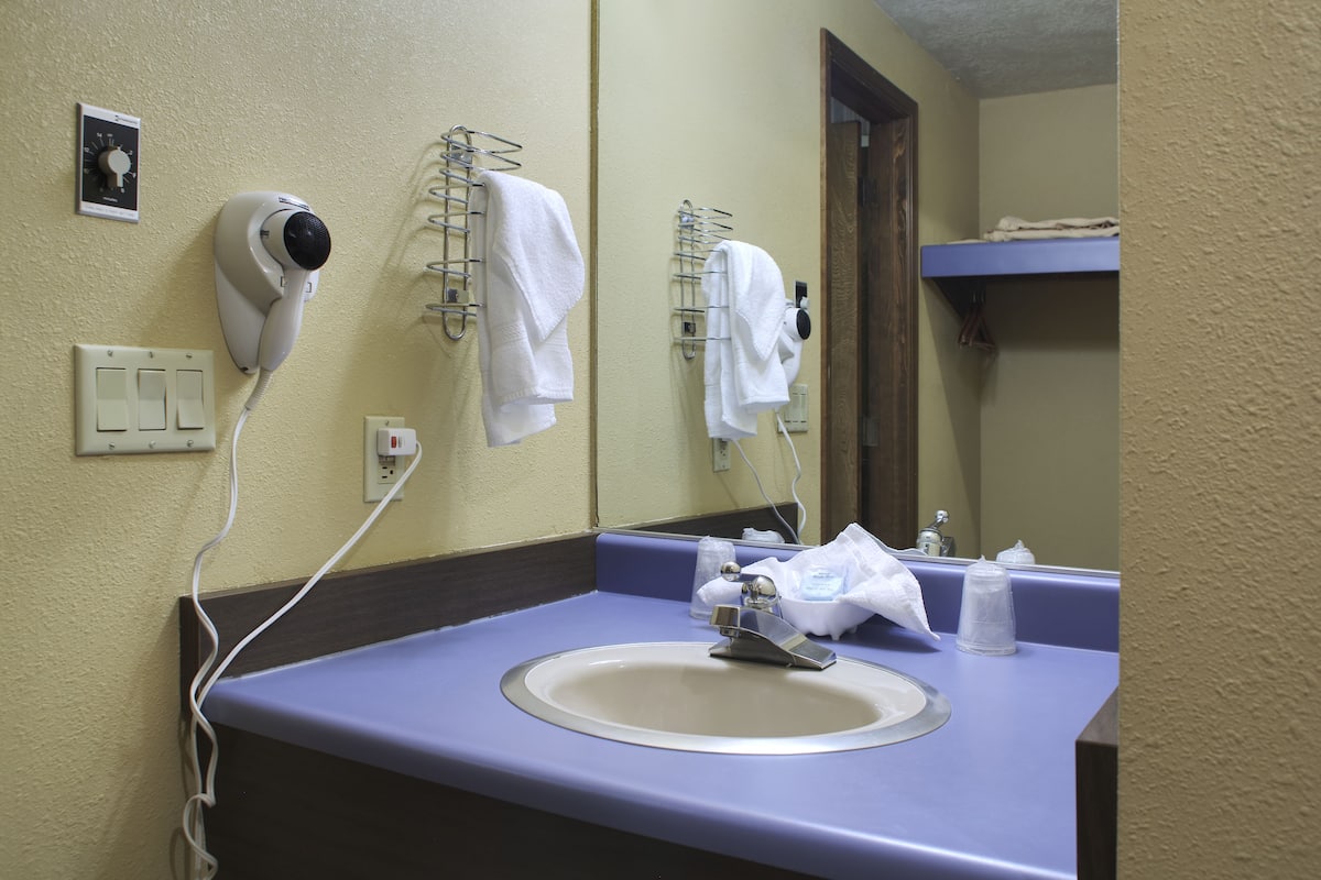 room, 1 king bed (located in building across the street) | bathroom sink