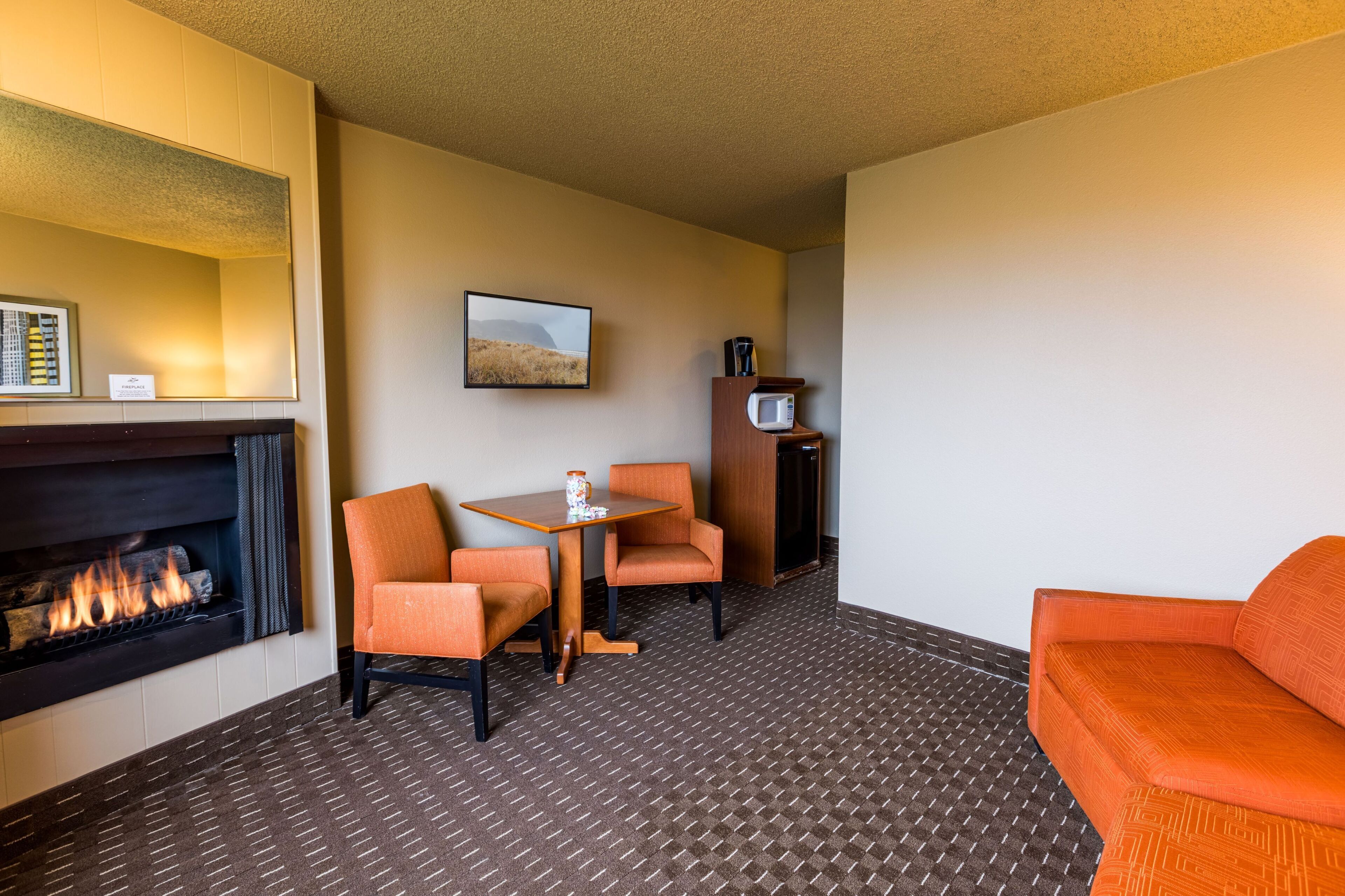 comfort suite | living area | 32-inch tv with cable channels, fireplace, dvd player