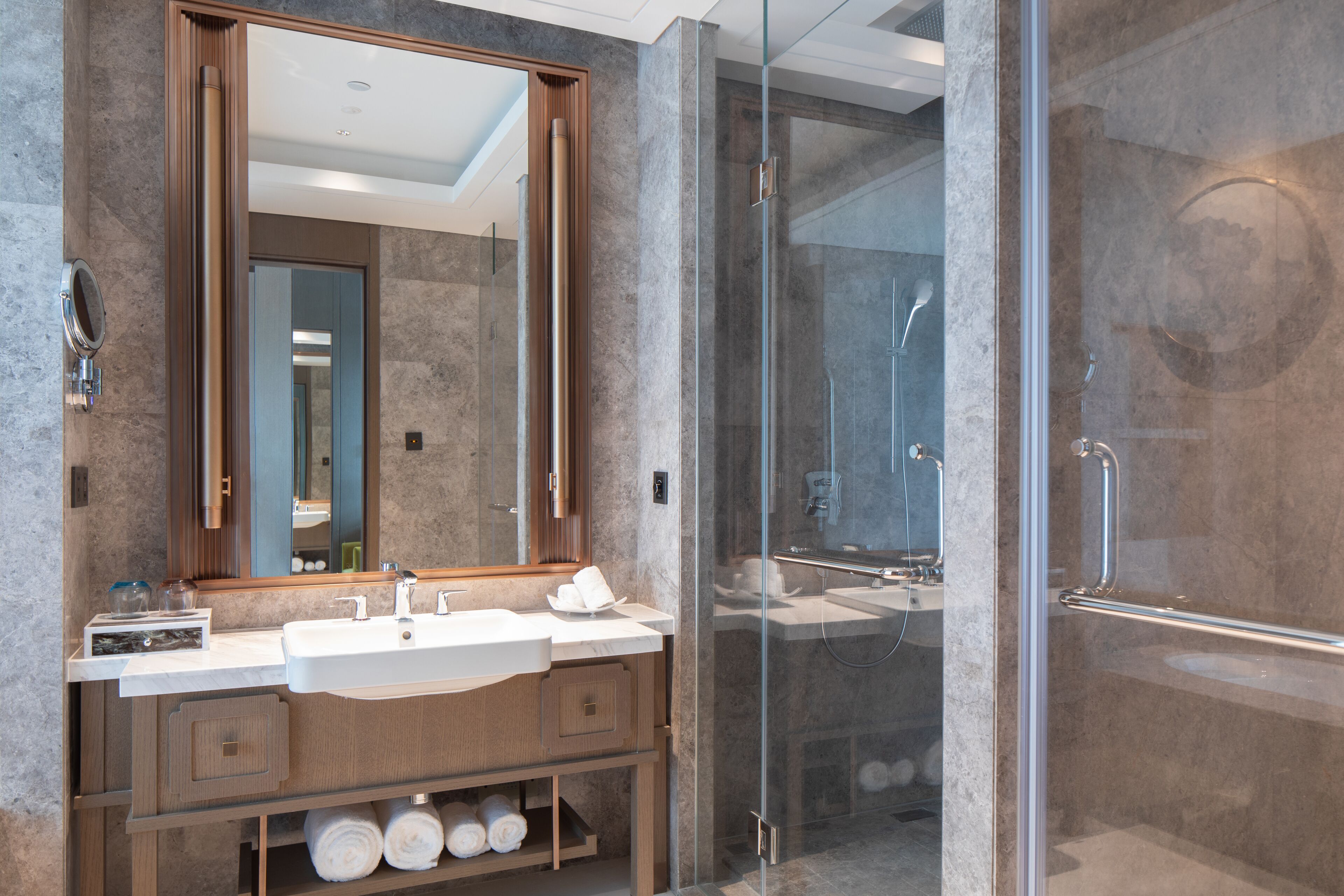 deluxe twin room | bathroom | rainfall showerhead, designer toiletries, hair dryer, bathrobes