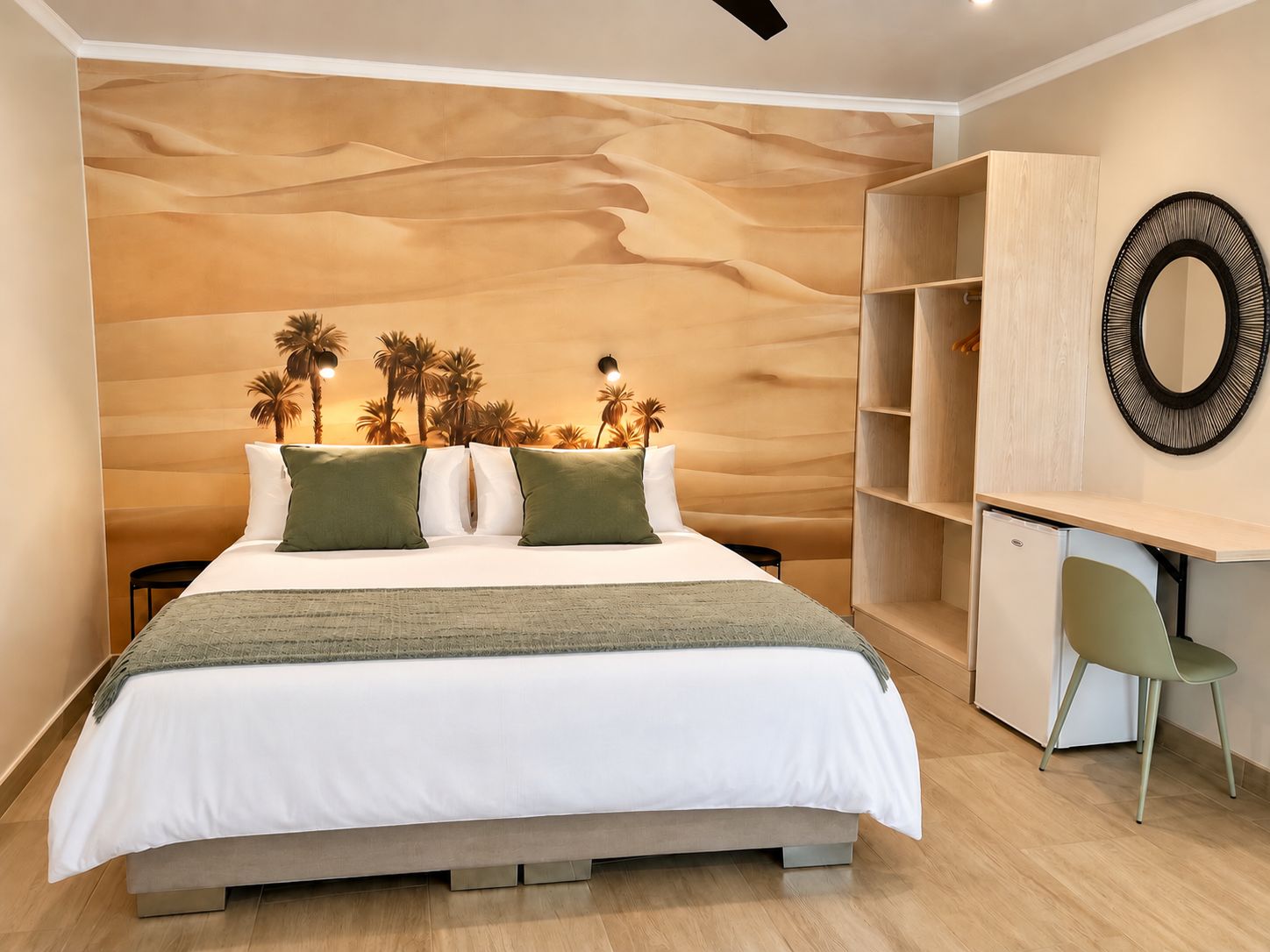 A modern bedroom with a large bed, a desk, and a chair.