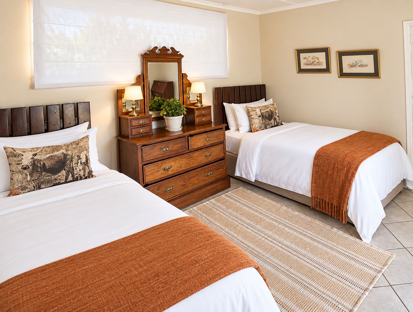 A bedroom with two beds, a dresser, a mirror, and a window with blinds.