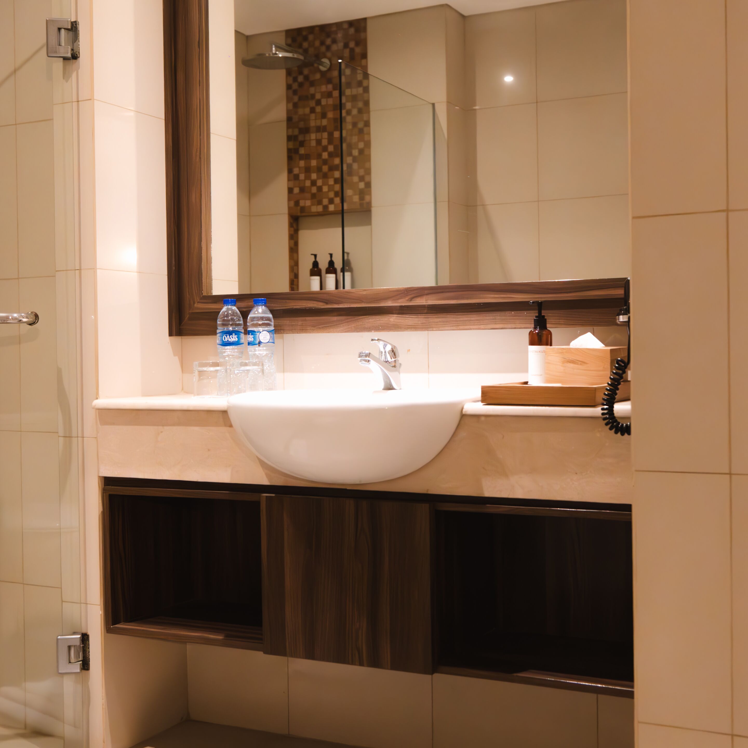 A bathroom with a white sink, a mirror, and a shower.
