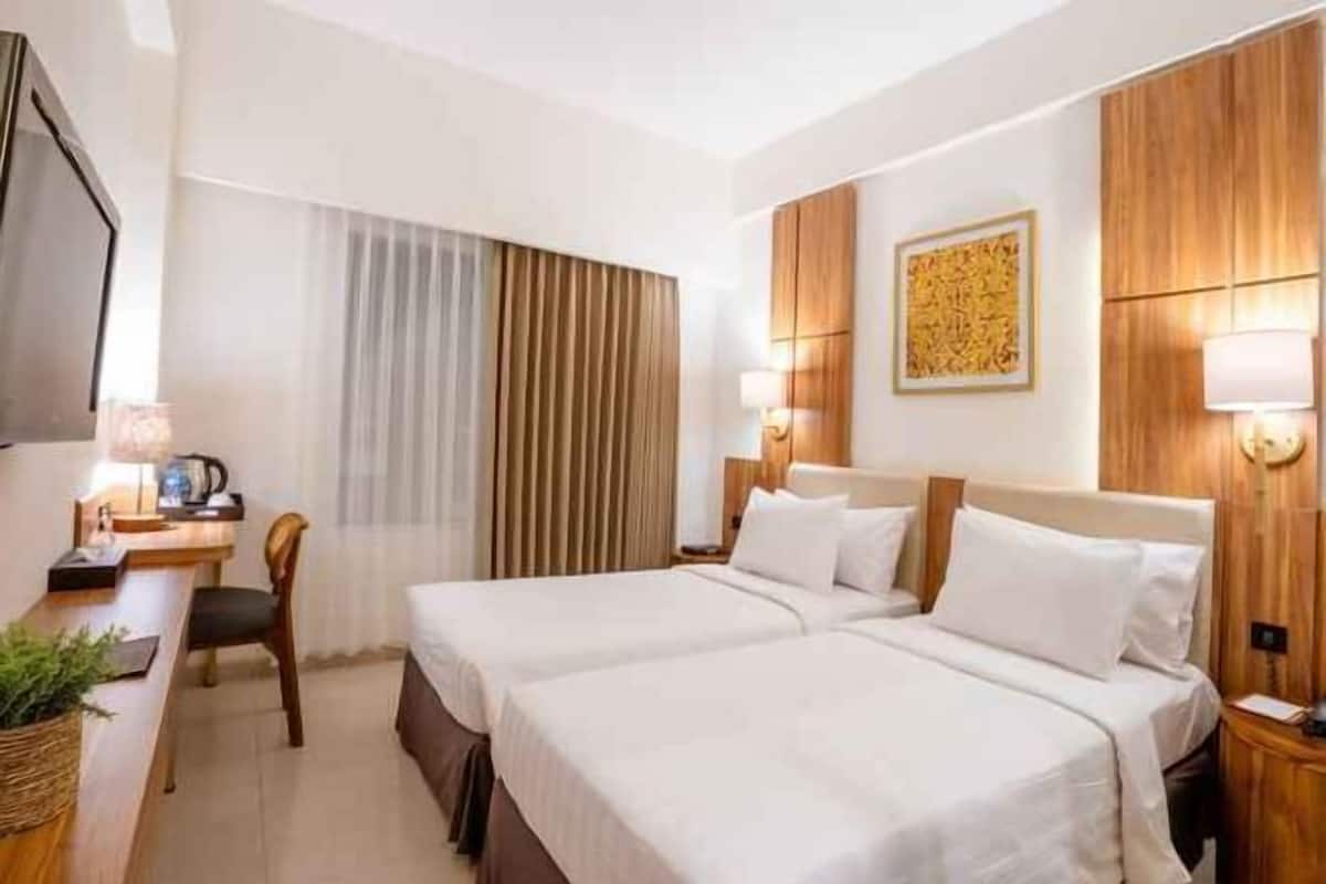 Free minibar items, in-room safe, desk, laptop workspace