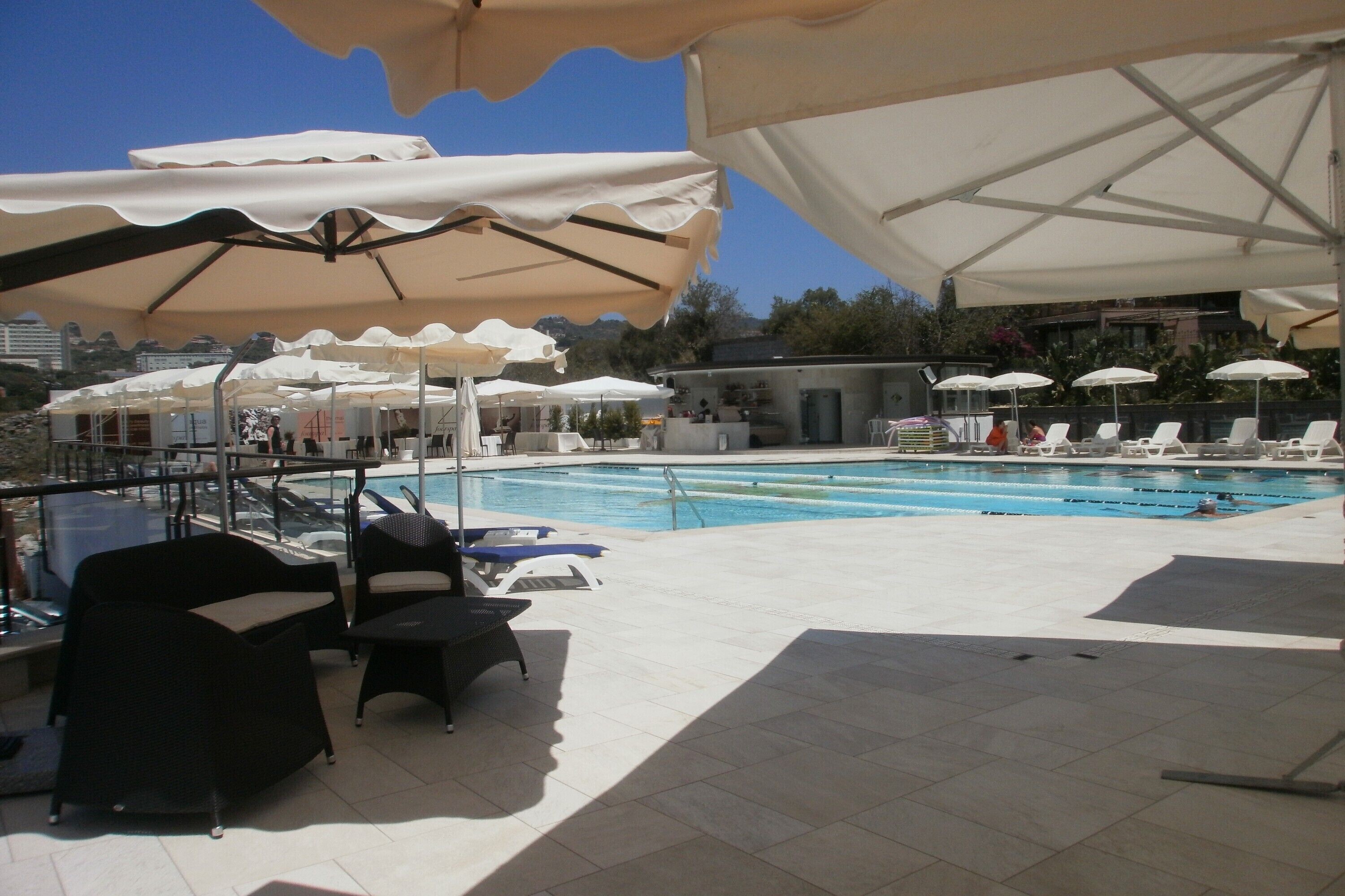 indoor pool, seasonal outdoor pool, pool umbrellas, pool loungers
