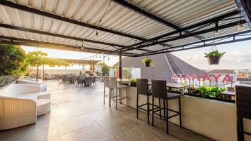 Outdoor pool, open 7:00 AM to 9:00 PM, pool umbrellas, pool loungers