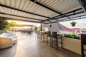 Outdoor pool, open 7:00 AM to 9:00 PM, pool umbrellas, pool loungers - The Atanaya Hotel Bali (Kuta)