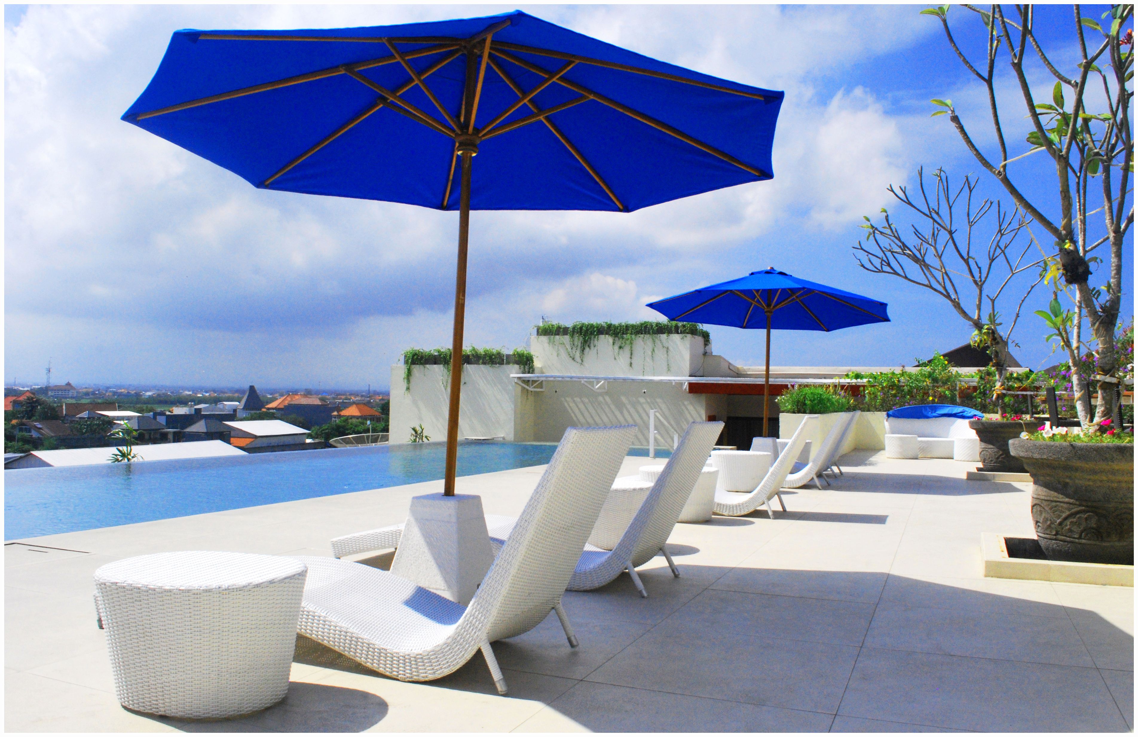 Outdoor pool, open 7:00 AM to 9:00 PM, pool umbrellas, pool loungers