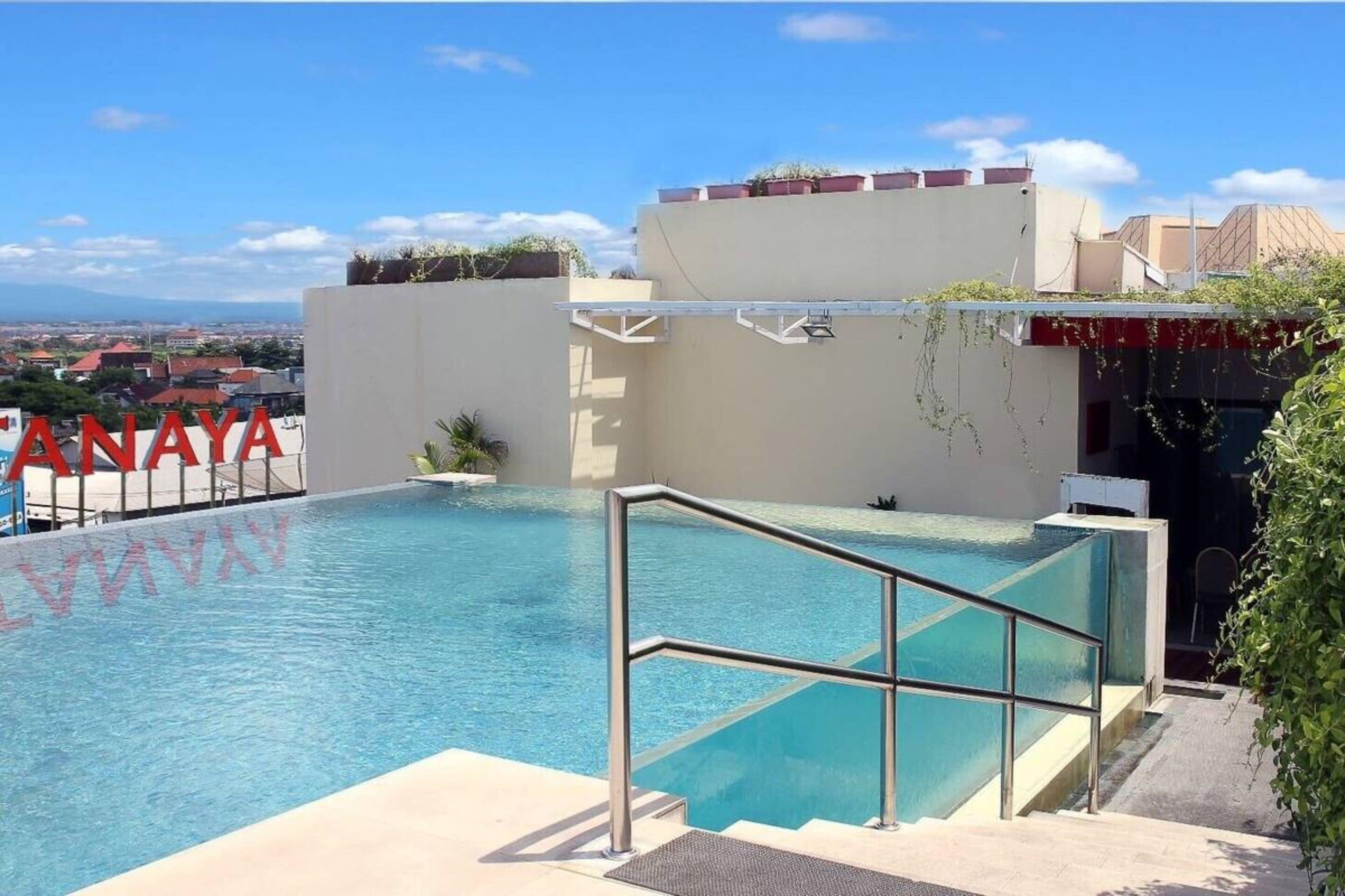 outdoor pool, open 7:00 am to 9:00 pm, pool umbrellas, pool loungers