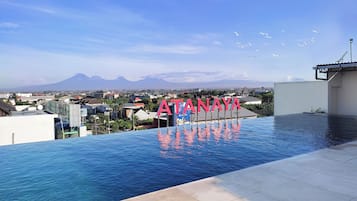 Outdoor pool, open 7:00 AM to 9:00 PM, pool umbrellas, sun loungers