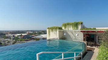 Outdoor pool, open 7:00 AM to 9:00 PM, pool umbrellas, sun loungers