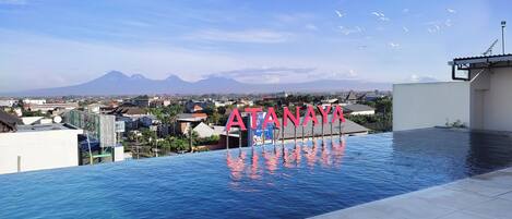 Outdoor pool, open 7:00 AM to 9:00 PM, pool umbrellas, sun loungers