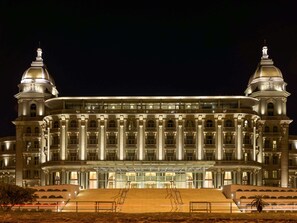 Stunning building with a classical facade, featuring columns, arches, and domes.