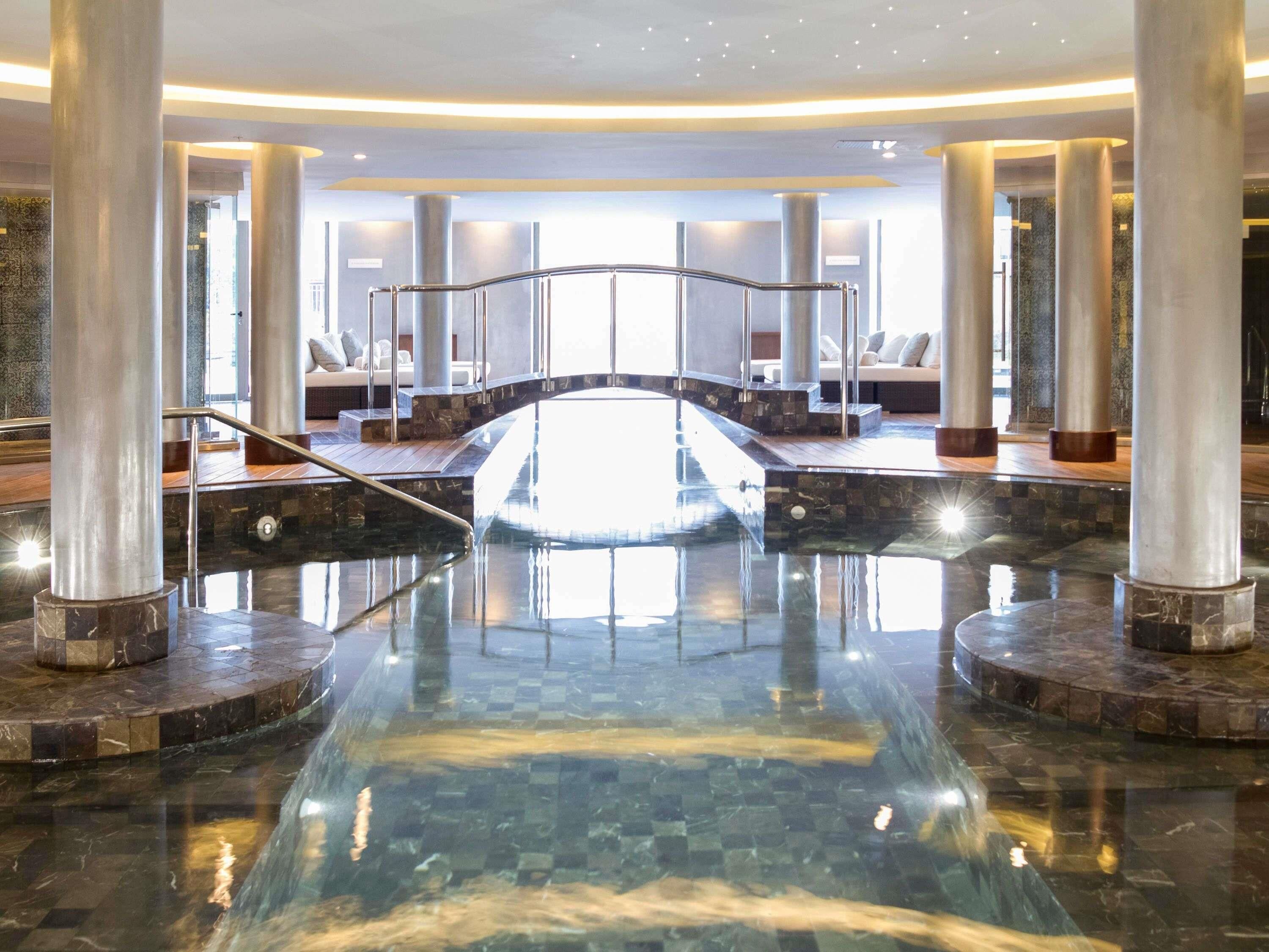Indoor pool, seasonal outdoor pool, pool umbrellas, pool loungers
