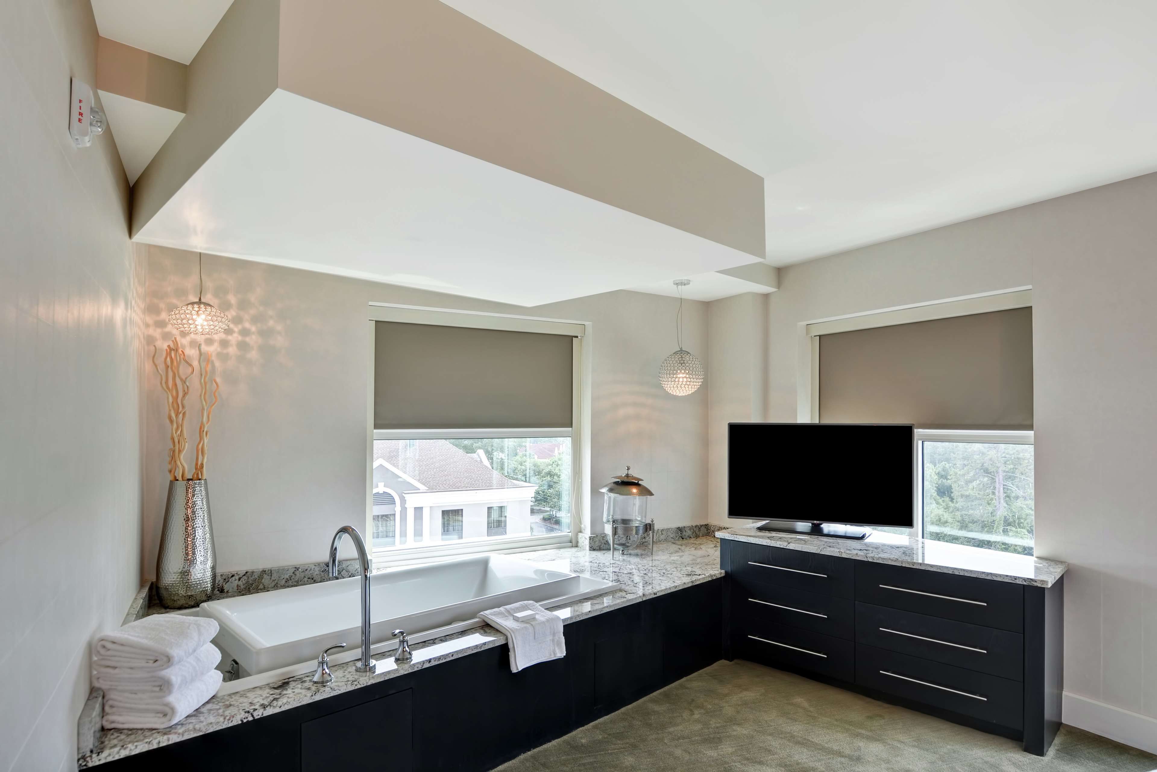 suite, 1 king bed, non smoking, jetted tub | 1 bedroom, in-room safe, desk, laptop workspace