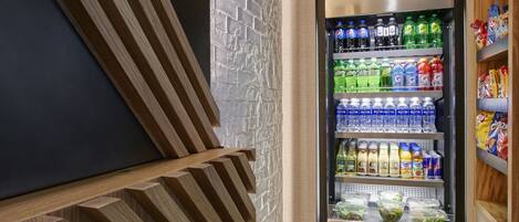 A vending machine with various beverages and snacks.