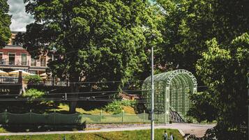 A park with a large green structure labeled "HASSELBACKEN" and a fence.