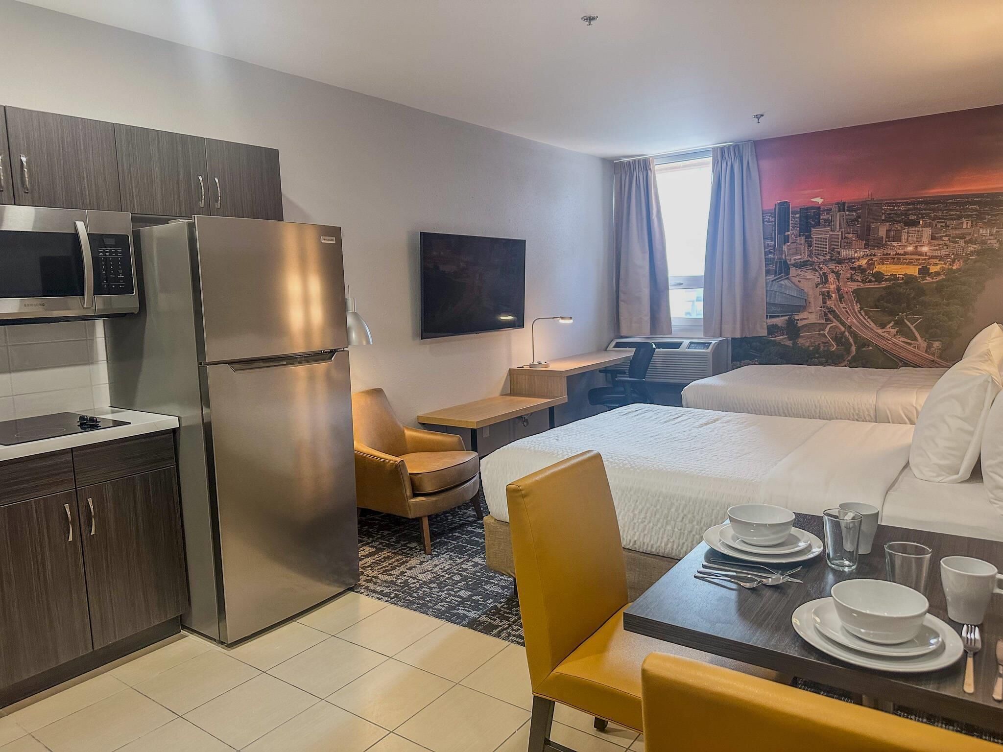 Pillowtop beds, desk, iron/ironing board, travel crib