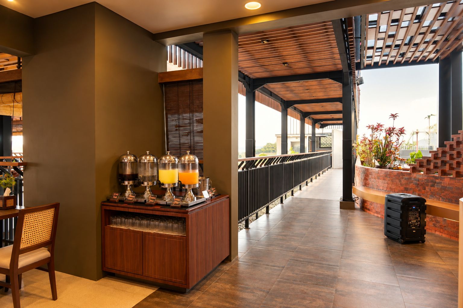 A modern interior with a bar area, a seating area with a chair, and a view through a glass partition.