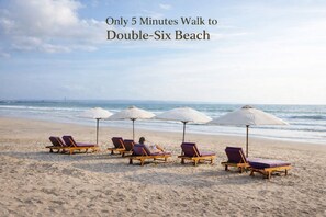 Beach nearby, white sand, beach towels