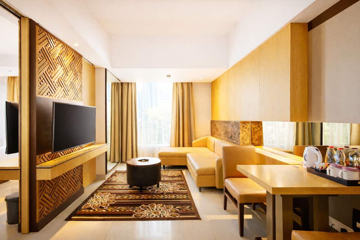 Horison Suite With Free Balinese Culture Experience and 1 Minibar | Living area | 42-inch Smart TV with digital channels