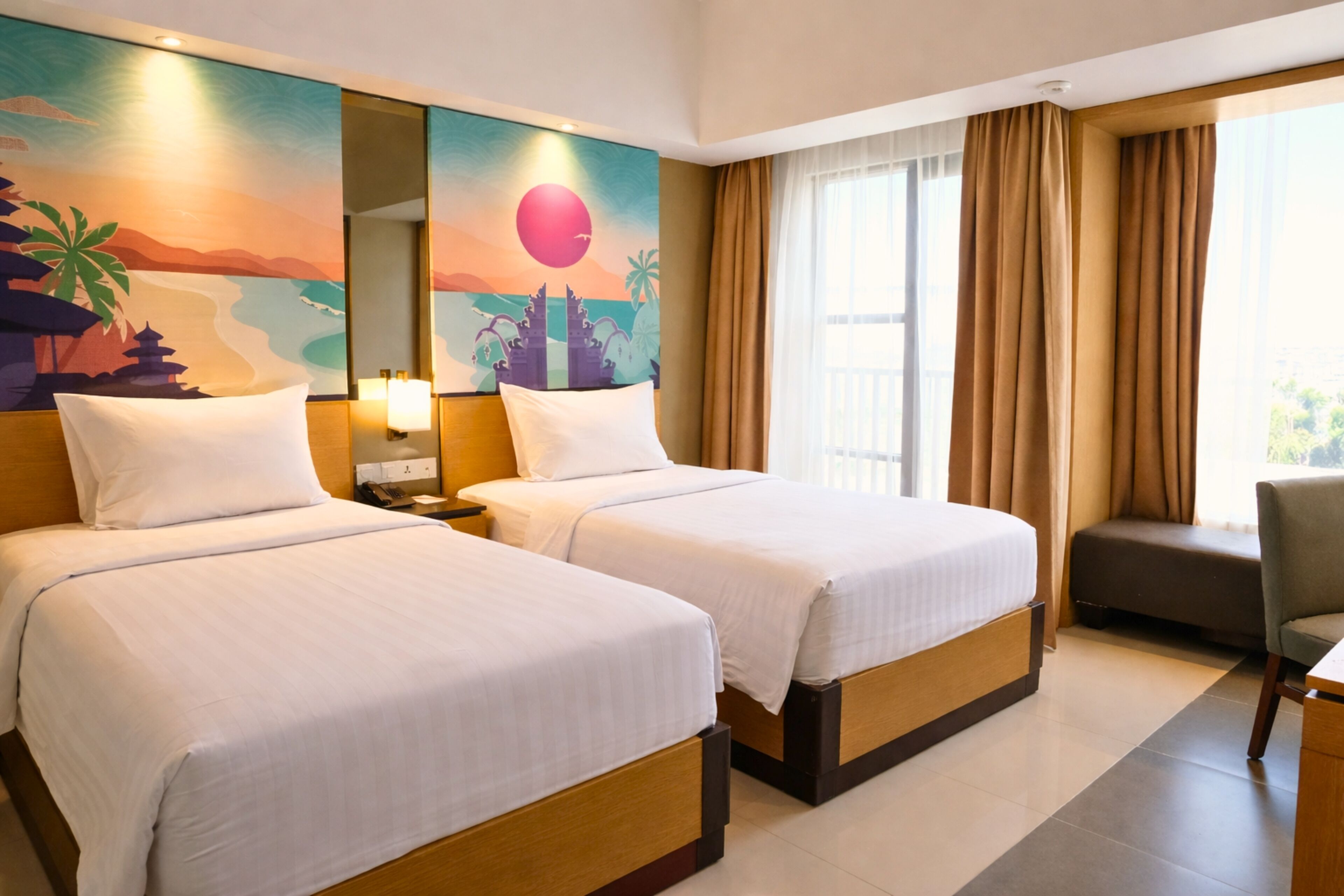 A hotel room with two beds, a desk, a chair, and a large window with curtains.