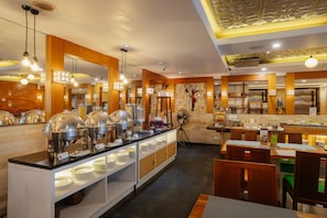 Breakfast, lunch served; international cuisine, pool views