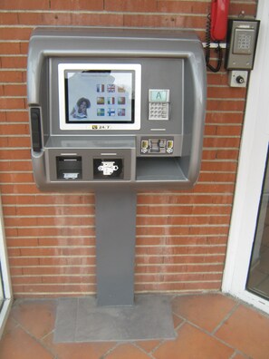 Convenient self-service kiosk with a screen and keypad for easy transactions and information retrieval.