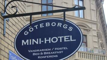 A sign for the Goteborgs Mini-Hotel, indicating it offers a bed and breakfast, breakfast, and conference facilities.