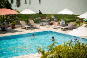 Outdoor pool, pool umbrellas, sun loungers