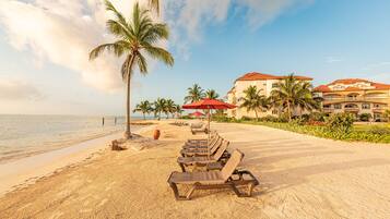 On the beach, sun-loungers, beach umbrellas, beach towels