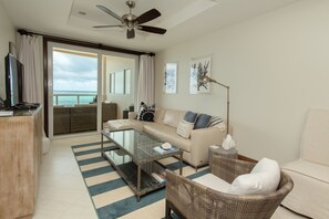 1 Bedroom Ocean Front Deluxe | Living area | 32-inch flat-screen TV with cable channels, TV - Grand Caribe Belize (San Pedro)