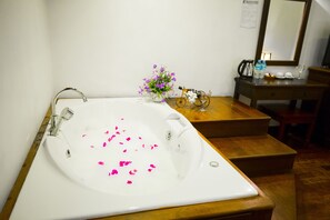 Executive Suite | Free minibar items, in-room safe, individually decorated, desk