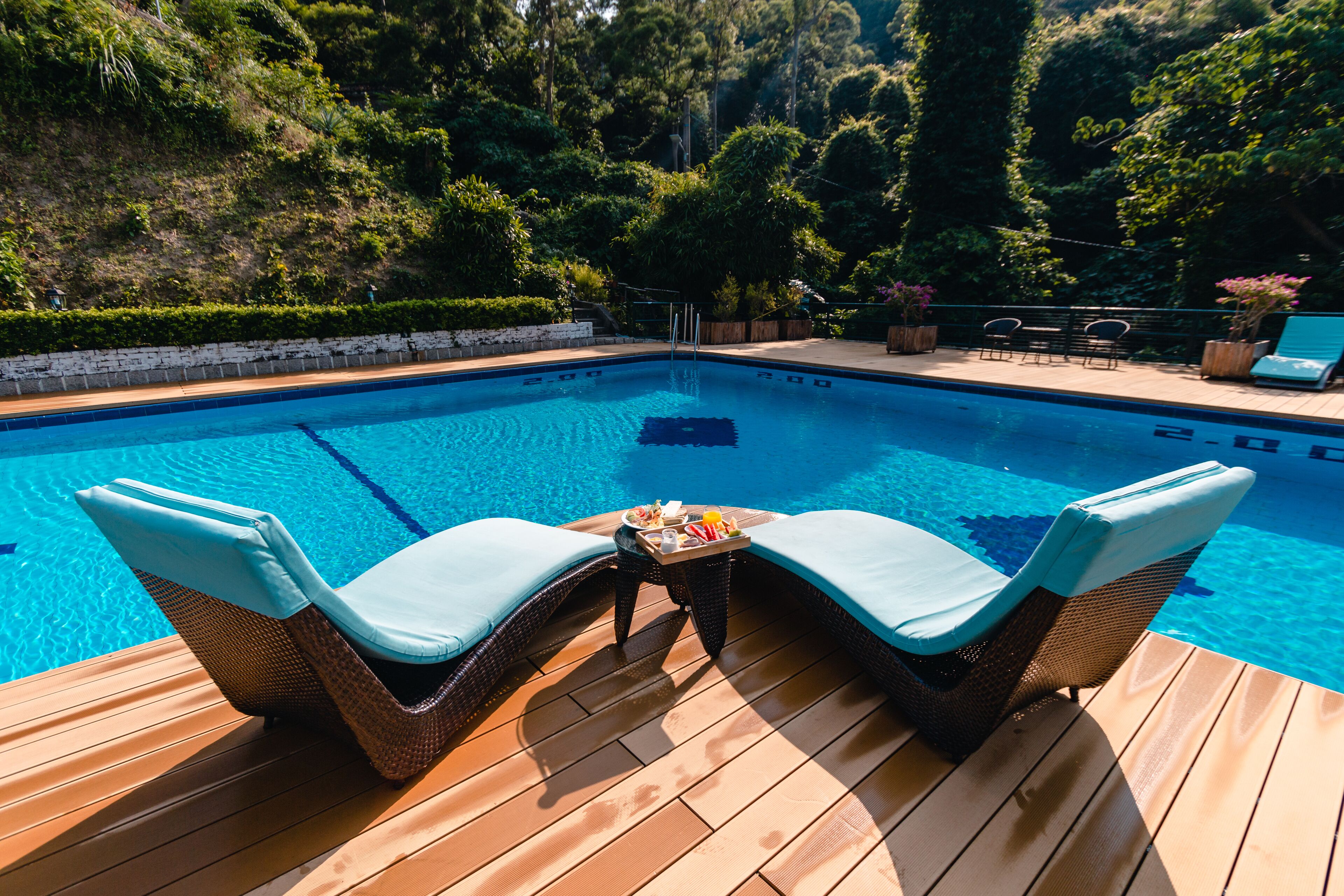 Seasonal outdoor pool, open 9:00 AM to 9:00 PM, pool umbrellas