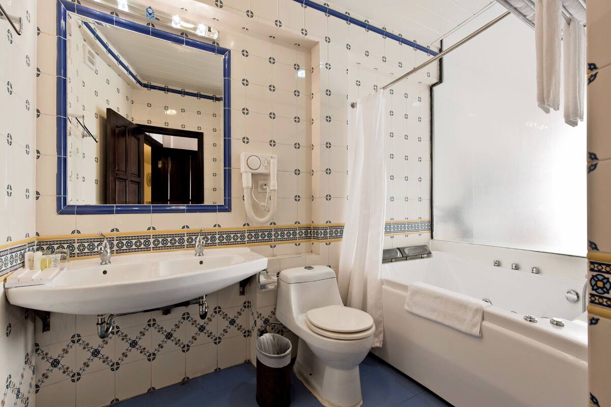 combined shower/bathtub, free toiletries, hair dryer, bathrobes