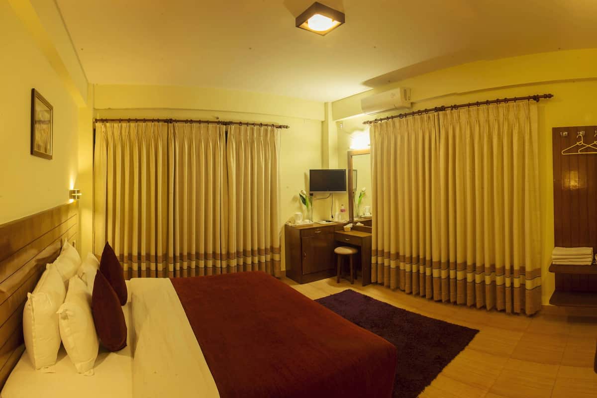 super deluxe mountain view room | premium bedding, in-room safe, individually decorated