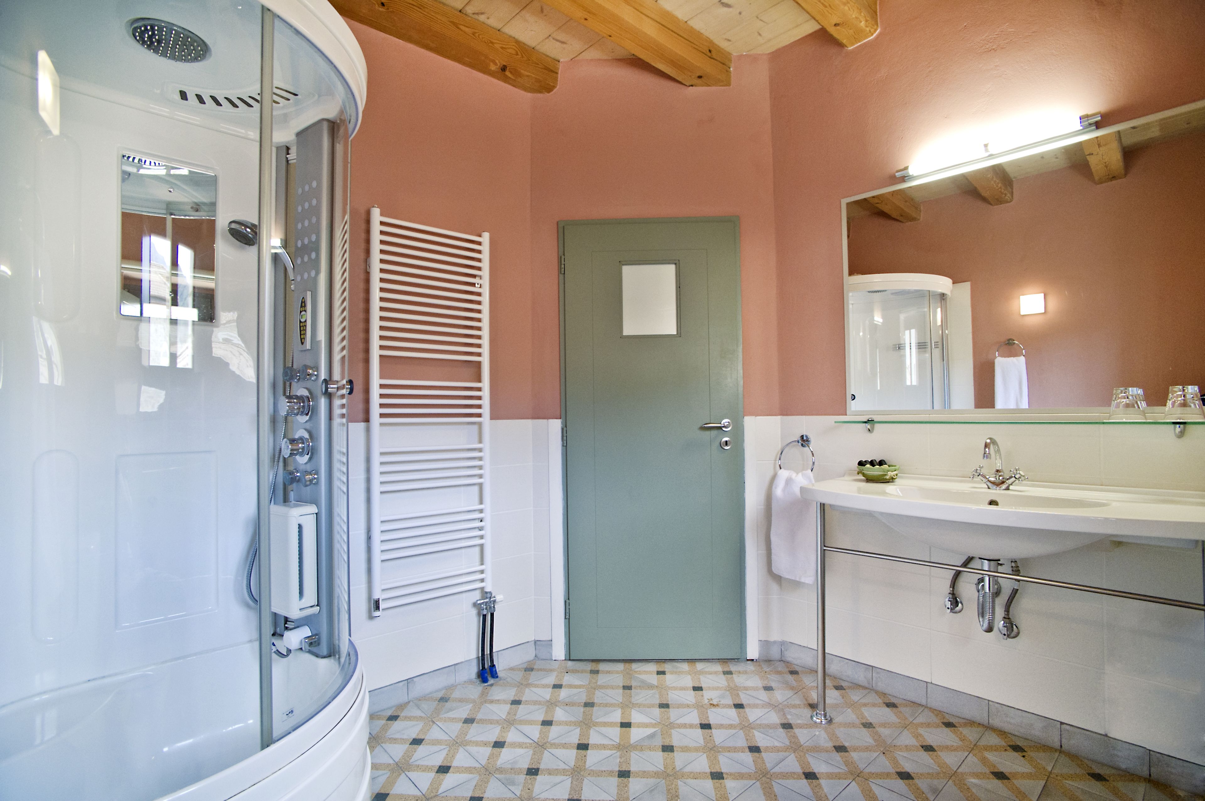 deluxe suite | bathroom | shower, rainfall showerhead, designer toiletries, hair dryer